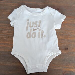 Nike Baby Onesie with "Just Do It" Logo - Cream/Beige